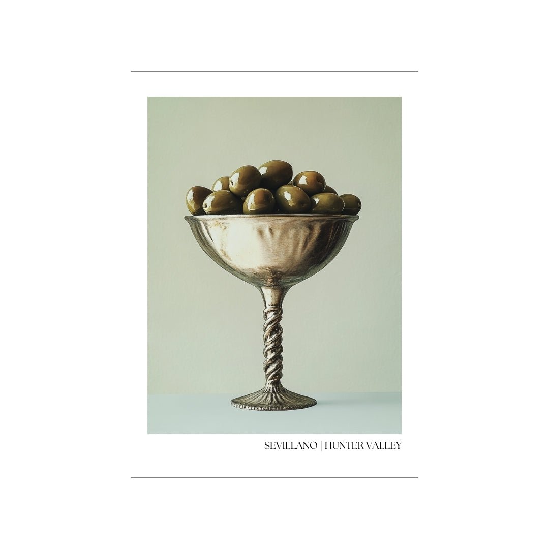 Elegant Sevillano olive poster by Thirsty Merchy, showcasing a vintage-inspired design with a metallic goblet filled with olives, celebrating the gourmet culture of Hunter Valley. Perfect for wine and food lovers, this artwork is available for purchase online, created in collaboration with Stay n' Sip to enhance your home decor and complement wine-tasting experiences