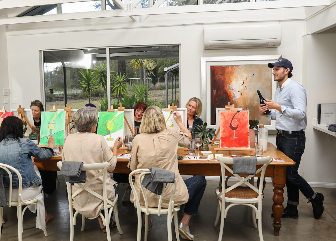 Group of Women enjoying a Paint n Wine Experience in Mio Monte at Winmark Wines.