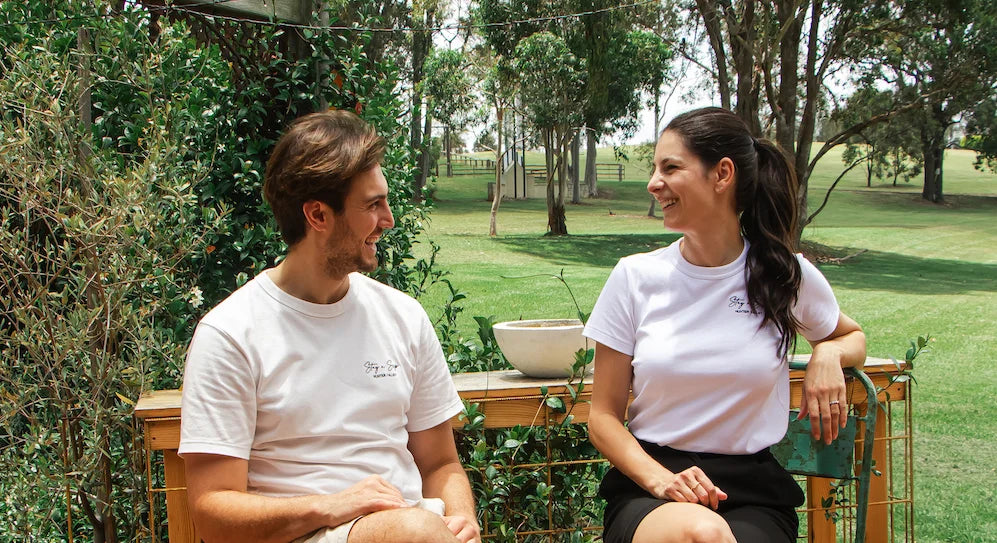Stay n’ Sip founders, Pierre and Mercedes, enjoying a relaxed moment outdoors, reflecting the friendly and welcoming spirit behind the Hunter Valley wine tasting experiences