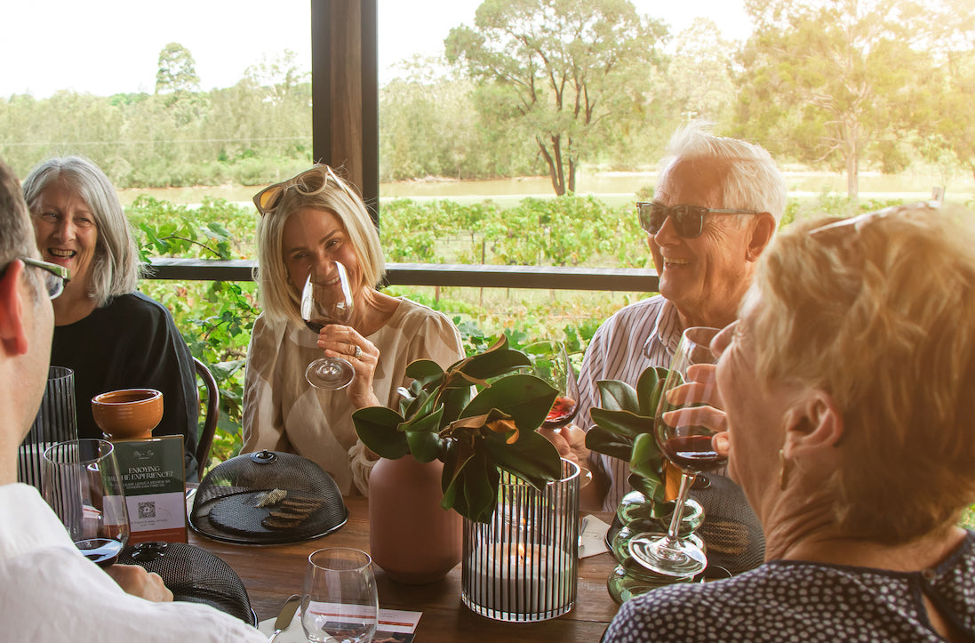 Group of friends enjoying a mobile wine tasting with Stay n' Sip, overlooking the vineyards in Hunter Valley, New South Wales